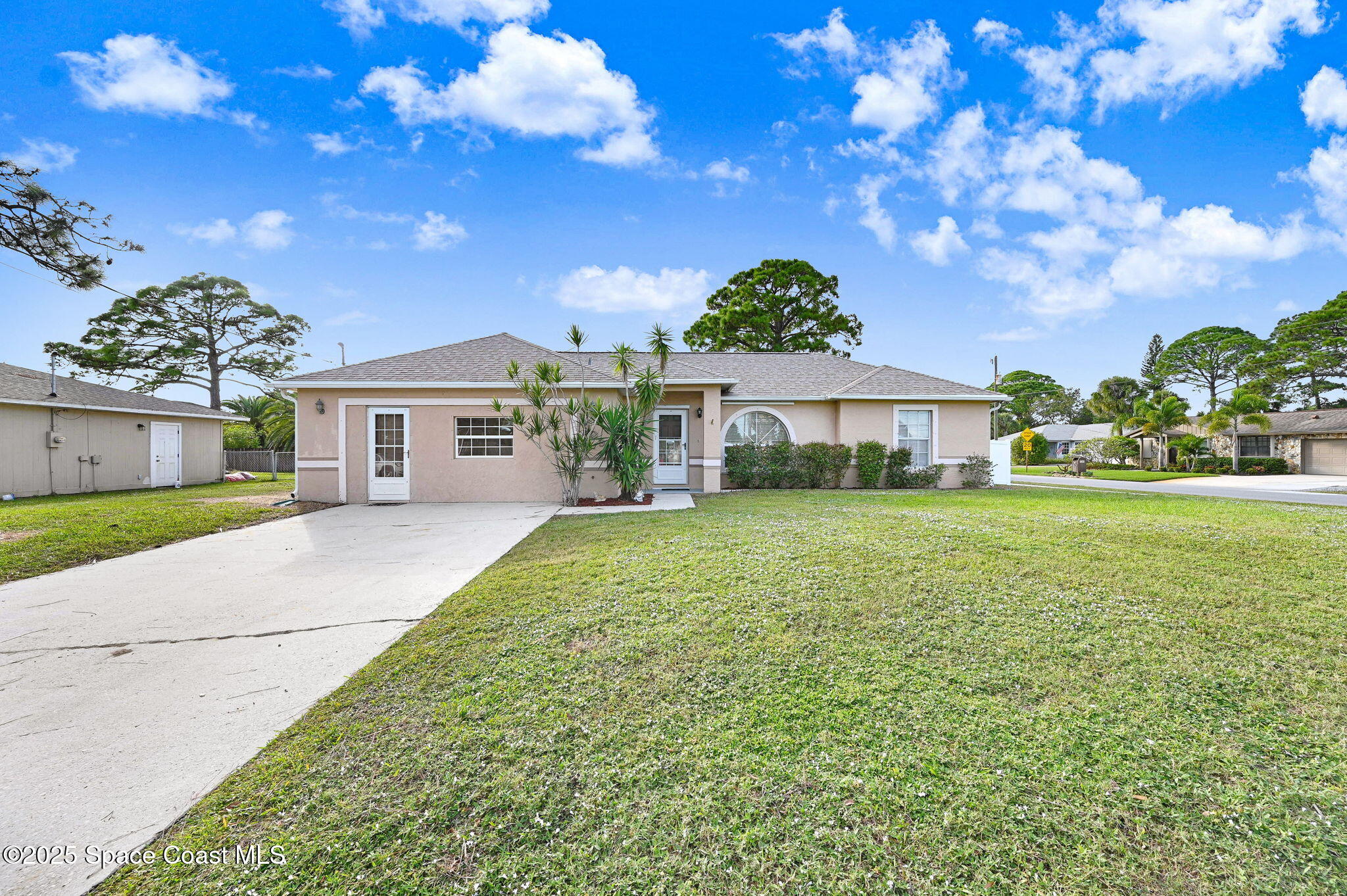 6094 Cardiff Avenue Cocoa, FL 32927 - Photo 44 of 48 a front view of a house with garden