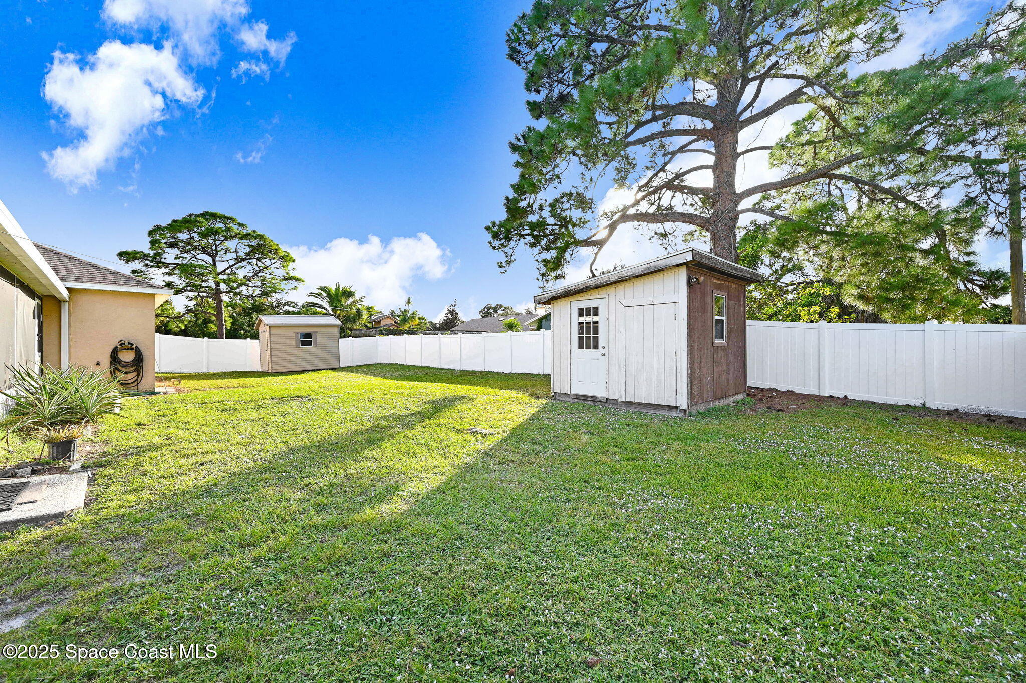 6094 Cardiff Avenue Cocoa, FL 32927 - Photo 8 of 48 a view of a house with a yard