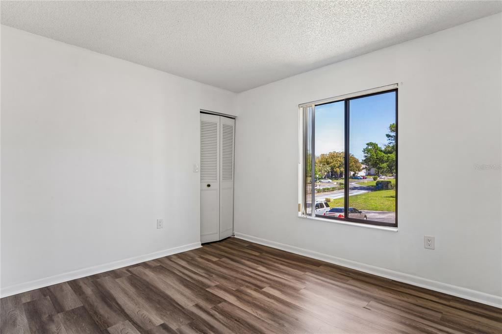 2522 Pine Ridge Way South, Unit D2 Palm Harbor, FL 34684 - Photo 26 of 38 a view of an empty room and window