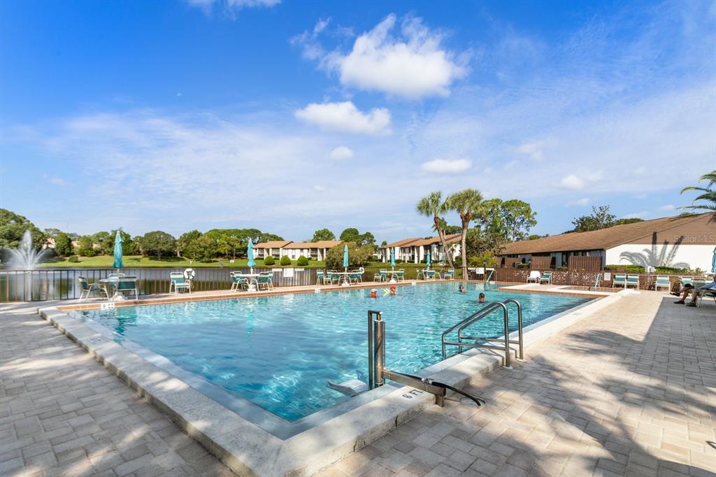 2522 Pine Ridge Way South, Unit D2 Palm Harbor, FL 34684 - Photo 34 of 38 a view of a lake with houses