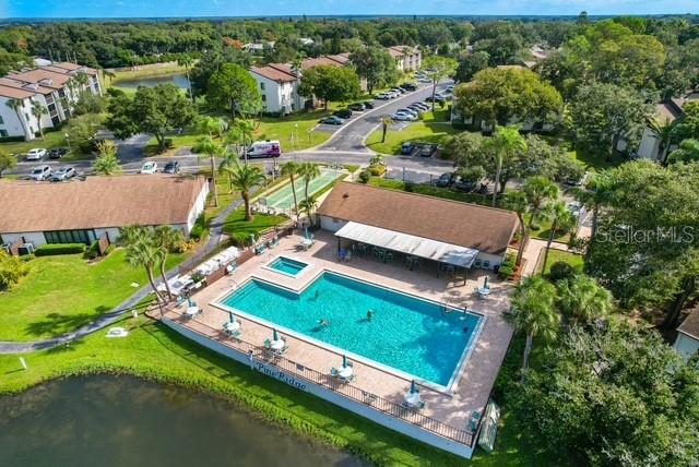 2522 Pine Ridge Way South, Unit D2 Palm Harbor, FL 34684 - Photo 35 of 38 an aerial view of a tennis ground and a mountain view