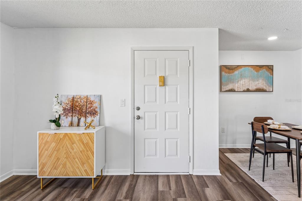 2522 Pine Ridge Way South, Unit D2 Palm Harbor, FL 34684 - Photo 4 of 38 a view of room with furniture and wooden floor