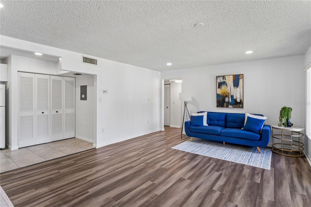 2522 Pine Ridge Way South, Unit D2 Palm Harbor, FL 34684 - Photo 6 of 38 a living room with furniture and a wooden floor