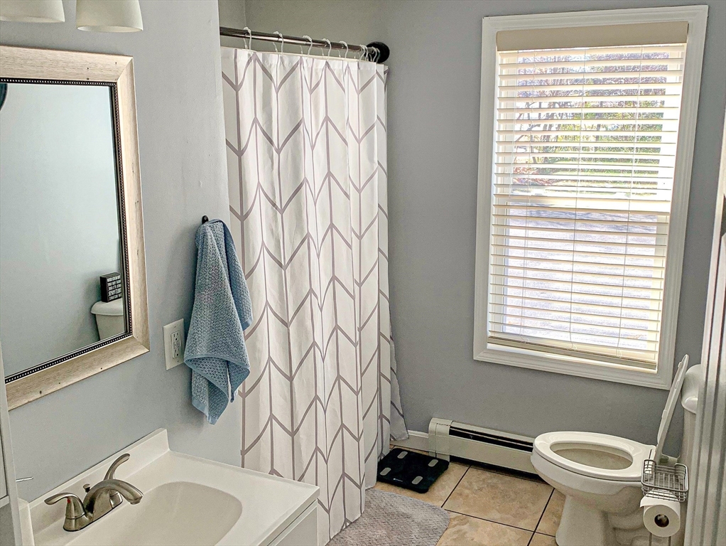 79 Kilmer Avenue Taunton, MA 02780 - Photo 11 of 13 a bathroom with a sink and a toilet
