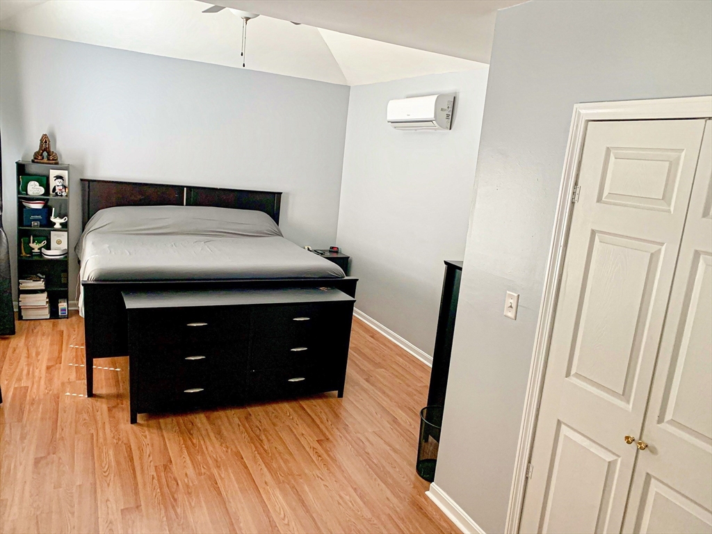 79 Kilmer Avenue Taunton, MA 02780 - Photo 13 of 13 a bedroom with a bed and a mirror