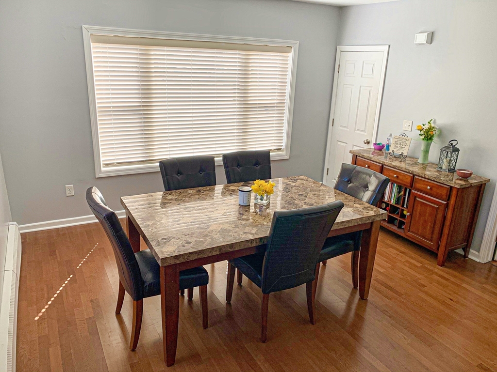 79 Kilmer Avenue Taunton, MA 02780 - Photo 8 of 13 a view of a dining room with furniture and wooden floor