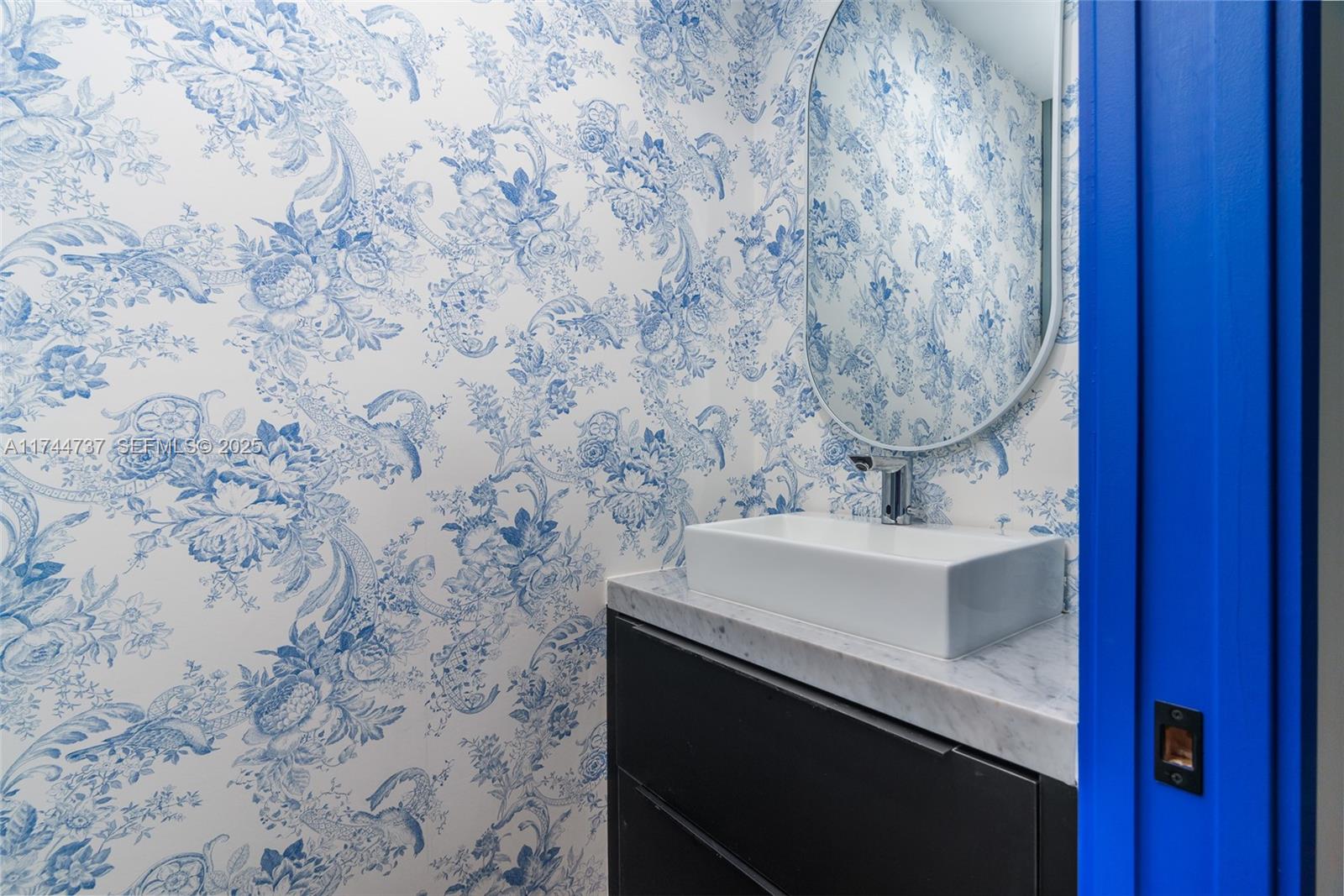 408 Northwest 52nd Street Miami, FL 33127 - Photo 18 of 73 a bathroom with a sink and a mirror