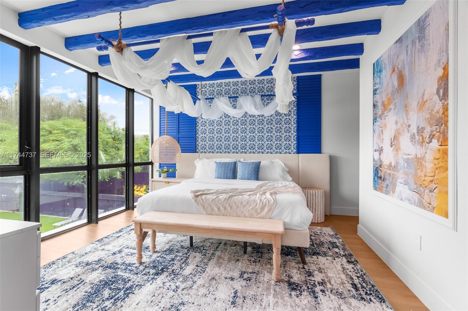 408 Northwest 52nd Street Miami, FL 33127 - Photo 43 of 73 a bed sitting in a bedroom next to a window