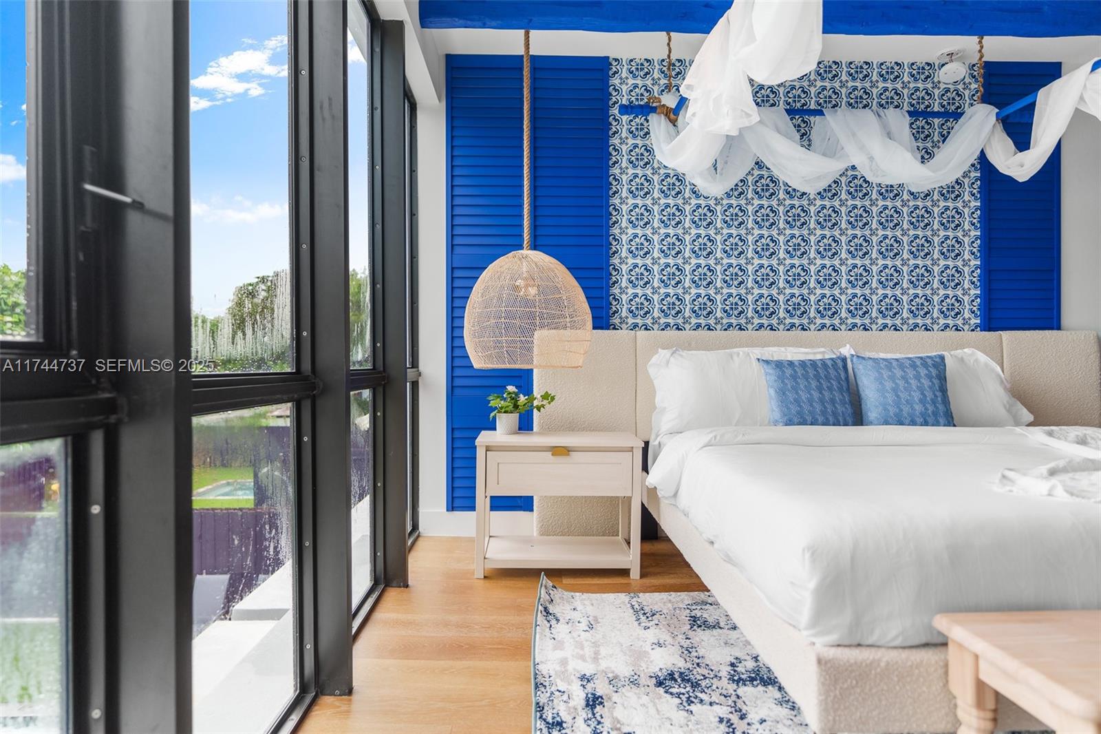 408 Northwest 52nd Street Miami, FL 33127 - Photo 45 of 73 a bedroom with a bed and a dresser