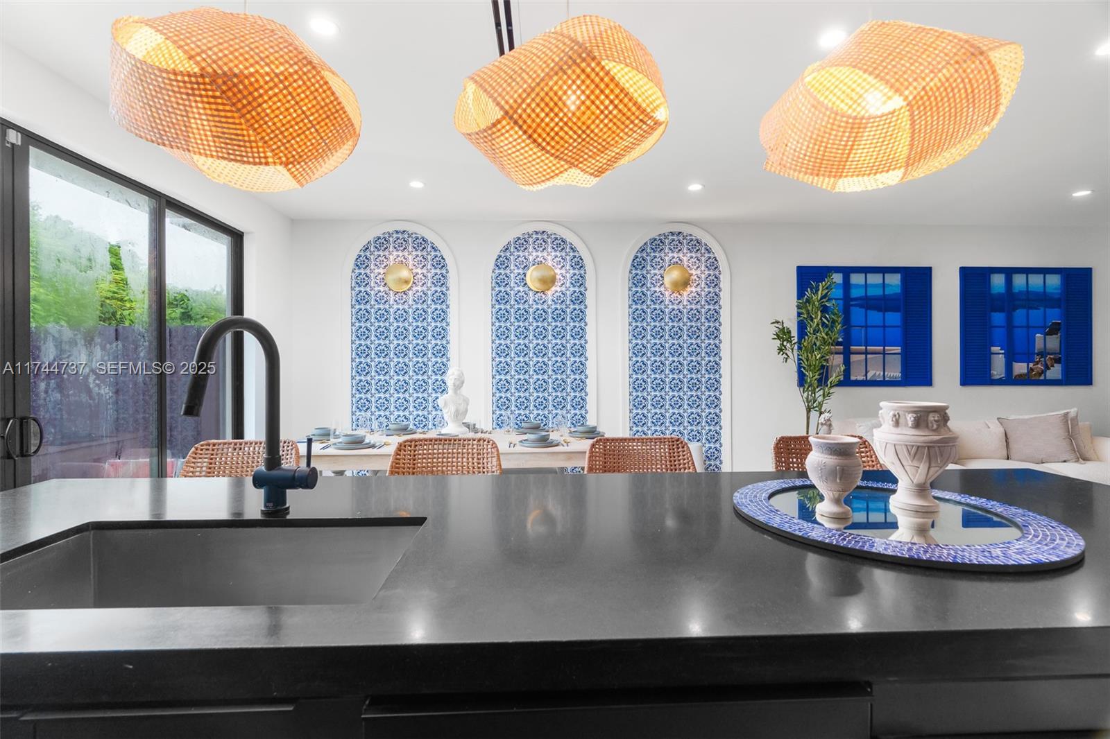 408 Northwest 52nd Street Miami, FL 33127 - Photo 7 of 73 a view of a dining room with furniture and chandelier