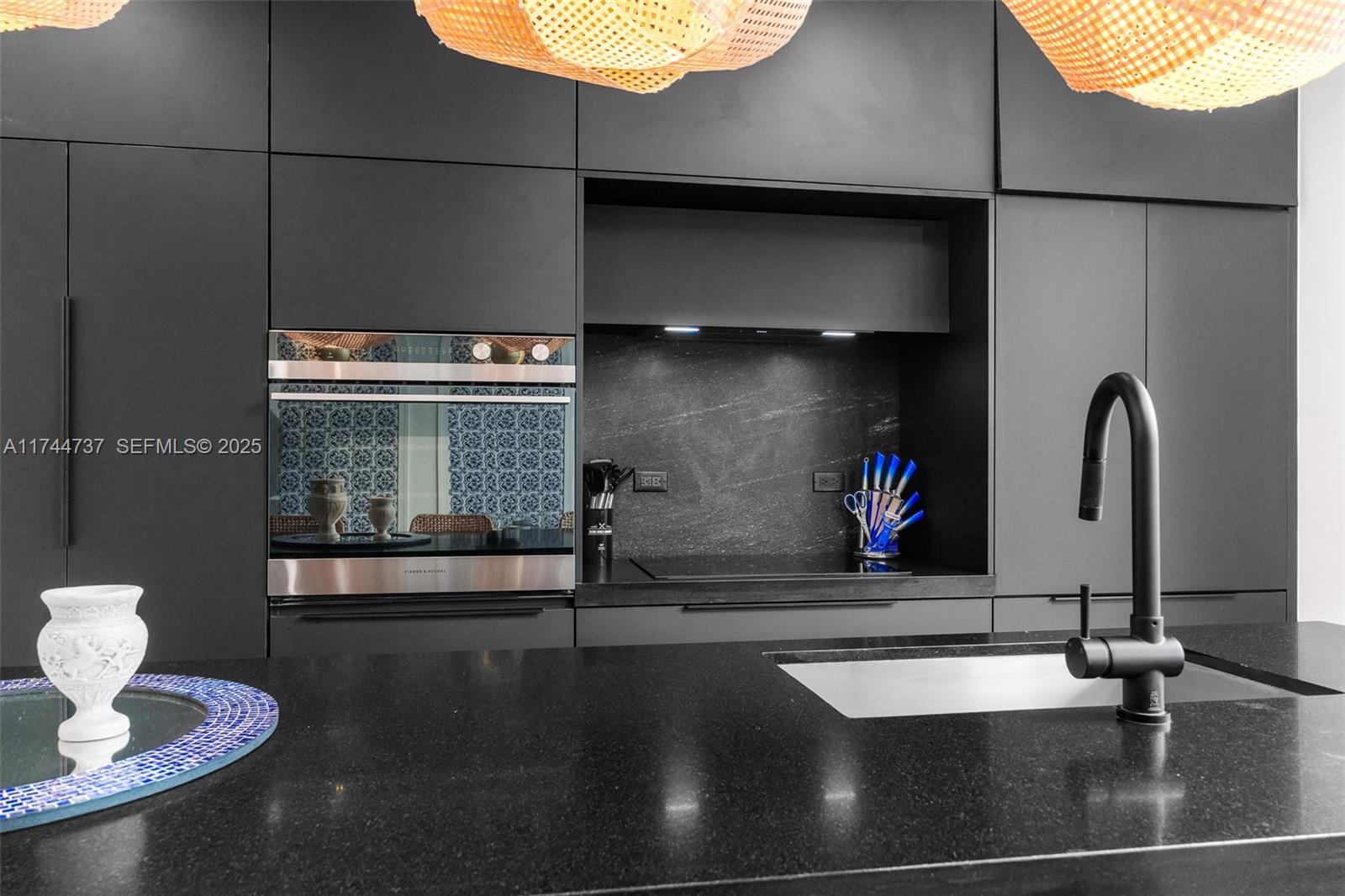 408 Northwest 52nd Street Miami, FL 33127 - Photo 9 of 73 a kitchen with a sink and a stove