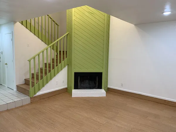 a view of entryway and hall with a front door