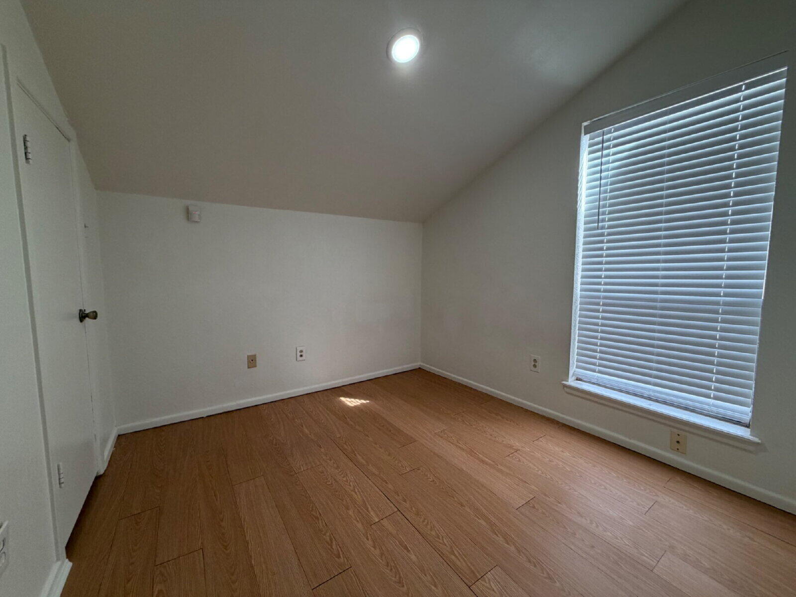 7201 Memphis Avenue, Unit B Lubbock, TX 79423 - Photo 6 of 14 an empty room with a window
