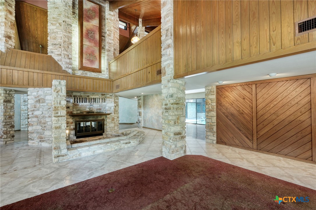 700 Breakaway Road Cedar Park, TX 78613 - Photo 3 of 38 Front entrance area looking at sunken fireplace sitting area and front living room