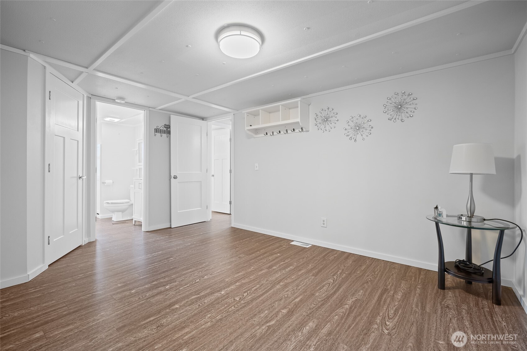 6978 Hannegan Road Lynden, WA 98264 - Photo 17 of 37 a view of a hallway with wooden floor