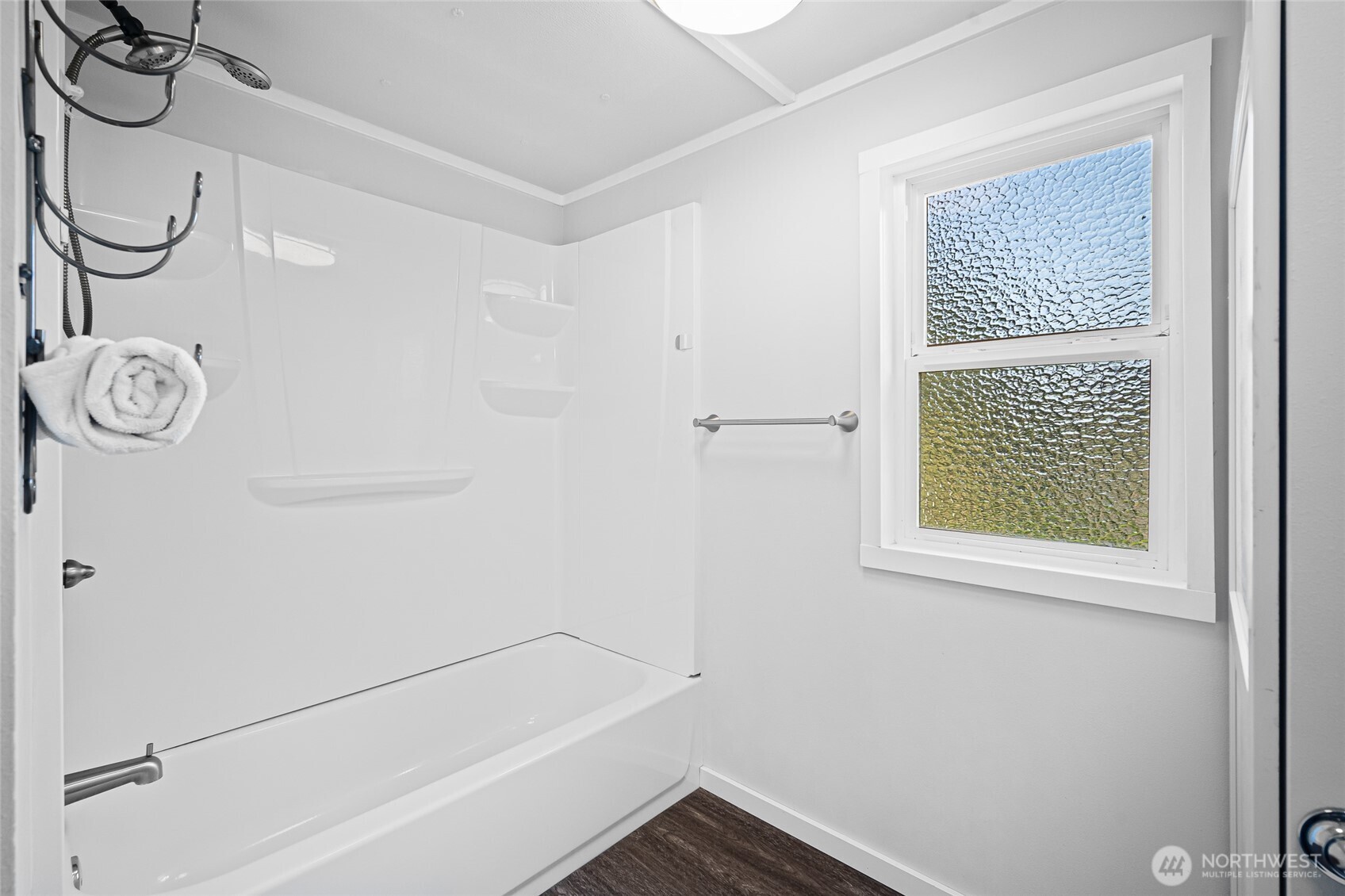 6978 Hannegan Road Lynden, WA 98264 - Photo 26 of 37 a bathroom with a bathtub and a shower