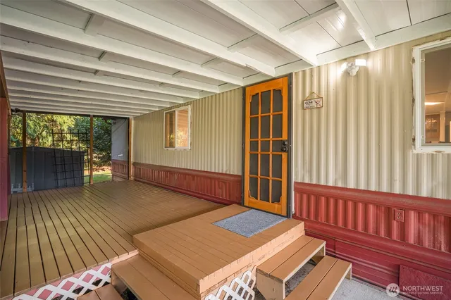 a bedroom with furniture and a window
