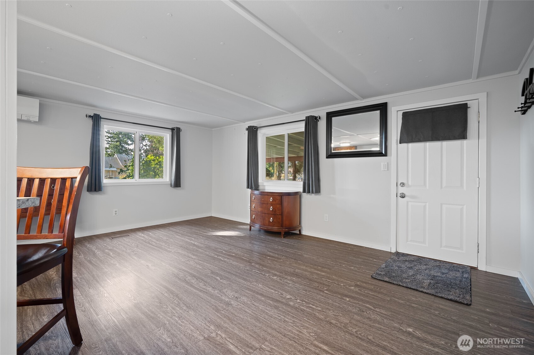 6978 Hannegan Road Lynden, WA 98264 - Photo 8 of 37 a view of an empty room with window and wooden floor