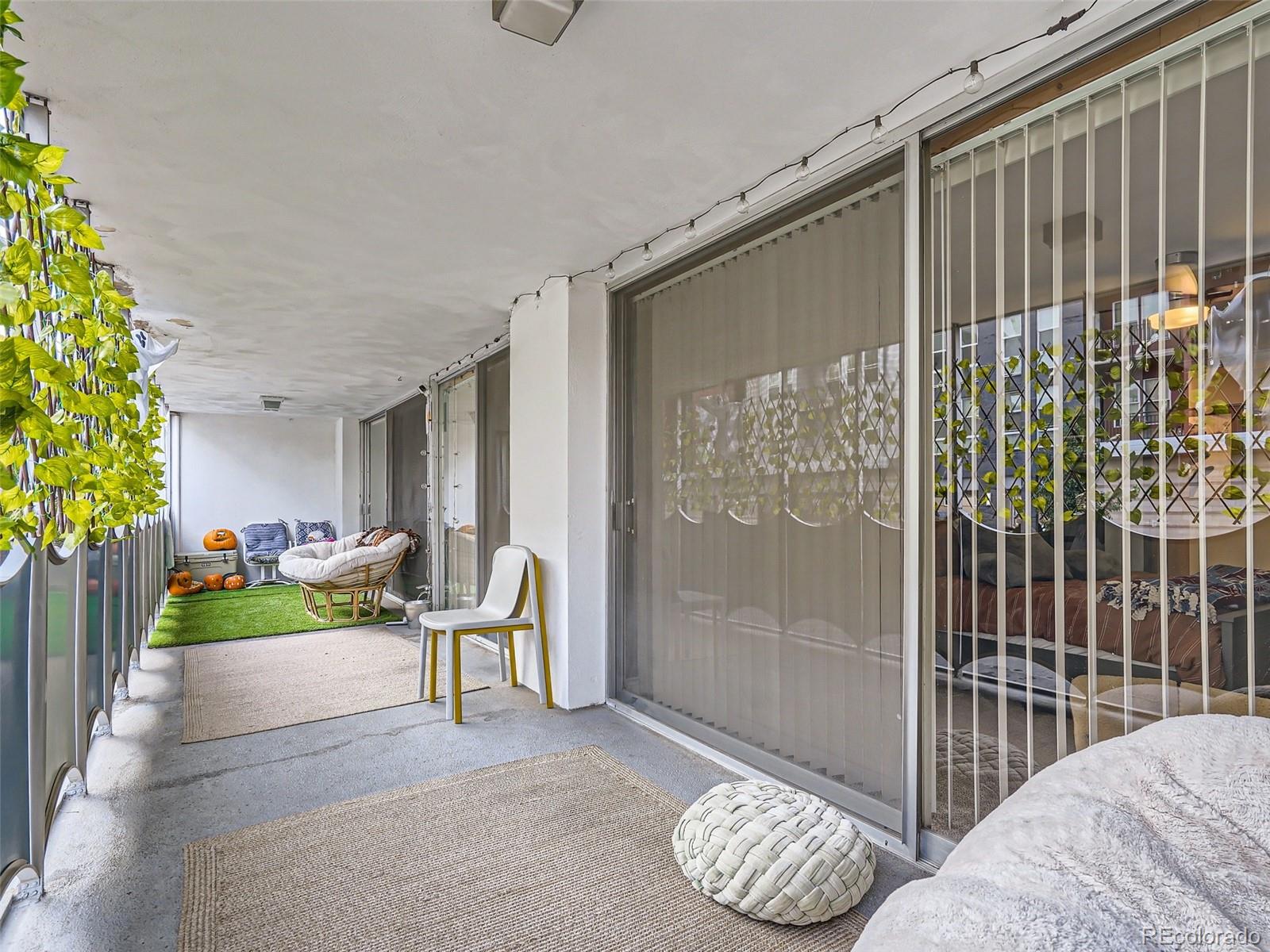 1155 Ash Street, Unit 202 Denver, CO 80220 - Photo 11 of 21 a balcony with furniture and a potted plant