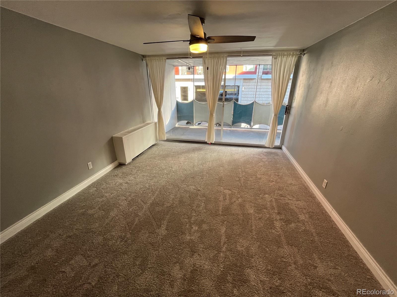 1155 Ash Street, Unit 202 Denver, CO 80220 - Photo 13 of 21 a view of a room with large windows