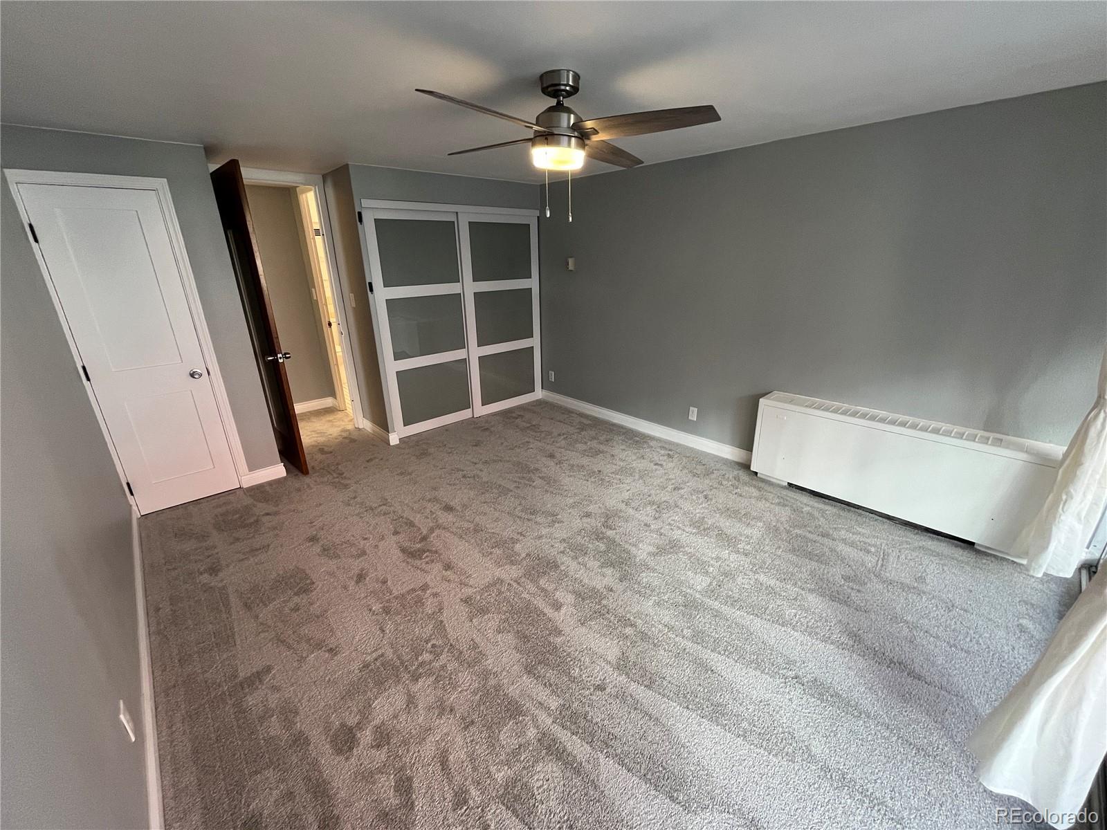1155 Ash Street, Unit 202 Denver, CO 80220 - Photo 14 of 21 an empty room with closet and a ceiling fan