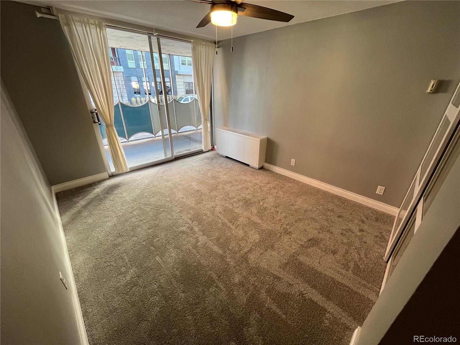 1155 Ash Street, Unit 202 Denver, CO 80220 - Photo 16 of 21 a view of an empty room with a window