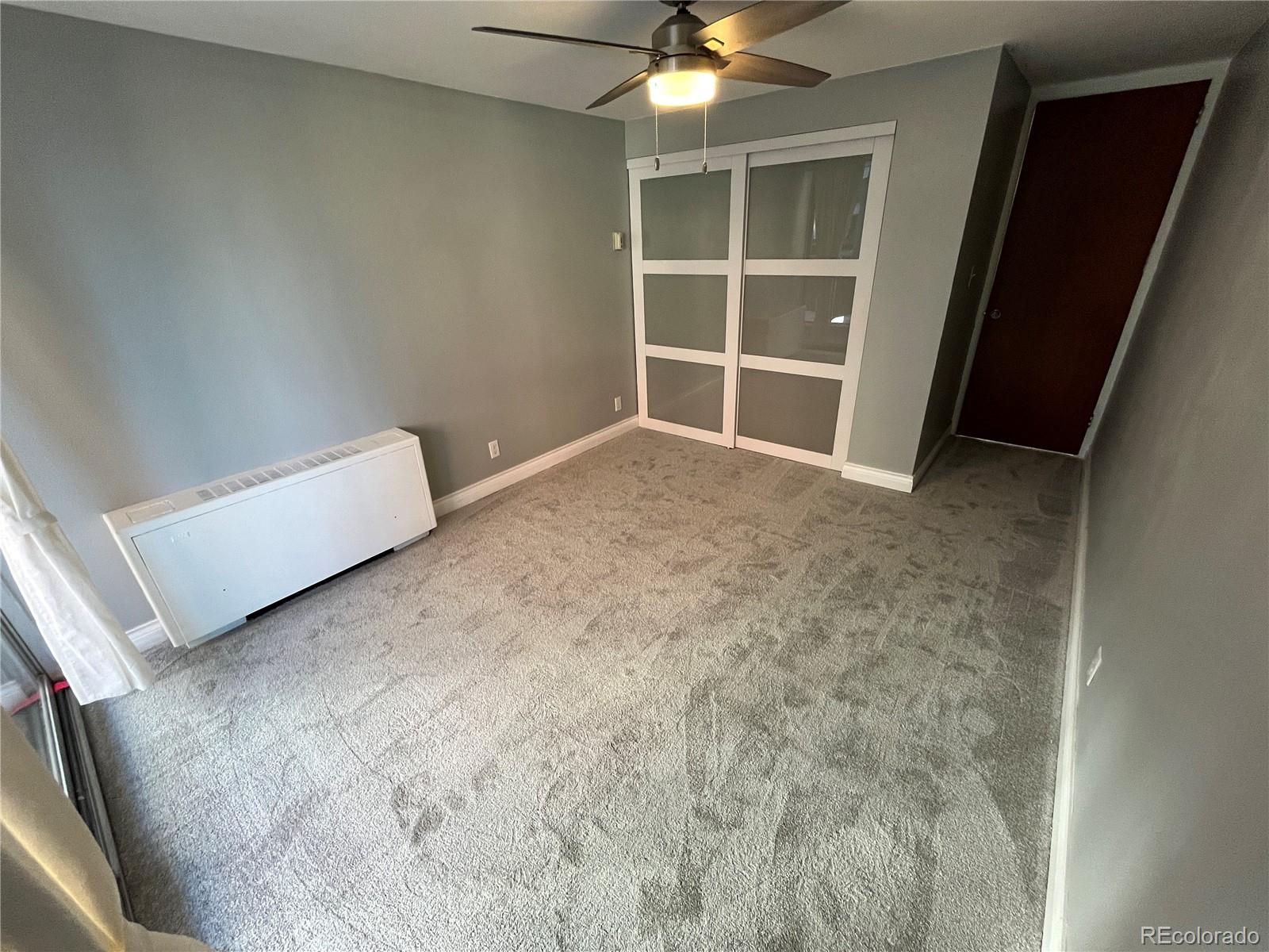 1155 Ash Street, Unit 202 Denver, CO 80220 - Photo 17 of 21 a view of an empty room with a window