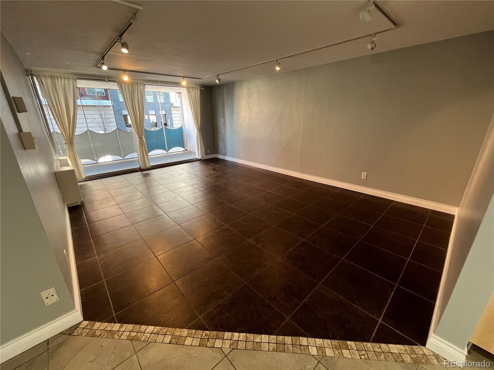 1155 Ash Street, Unit 202 Denver, CO 80220 - Photo 18 of 21 a view of an empty room with a window