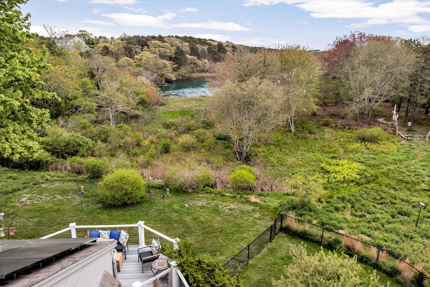 597 Orleans Road North Chatham, MA 02650 - Photo 13 of 76 Deck view of field and water