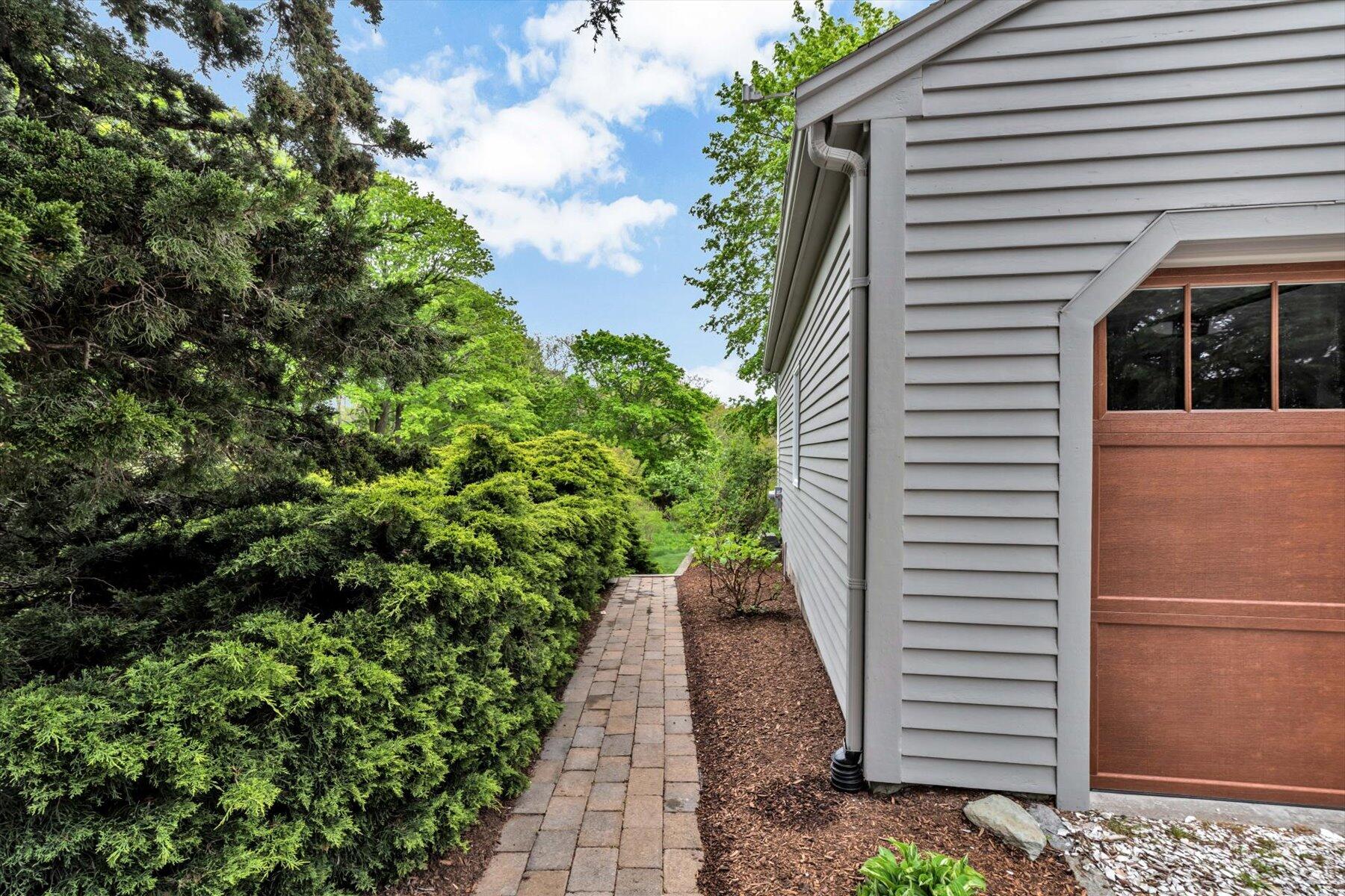 597 Orleans Road North Chatham, MA 02650 - Photo 18 of 76 Left side walkway to back