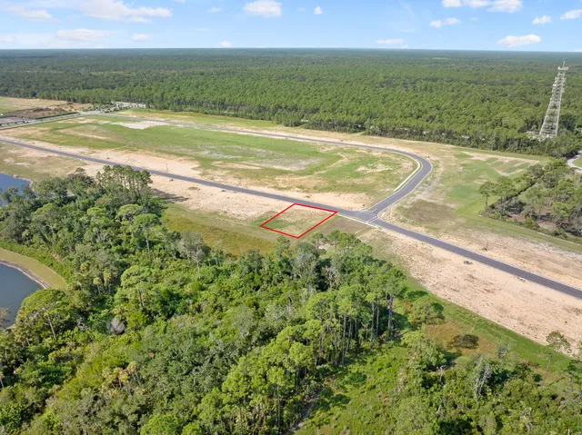 a view of a field with an ocean view