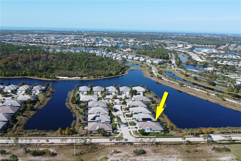 6809 Bequia Way Naples, FL 34113 - Photo 35 of 49 View of property location with a large body of water and nearby suburban area