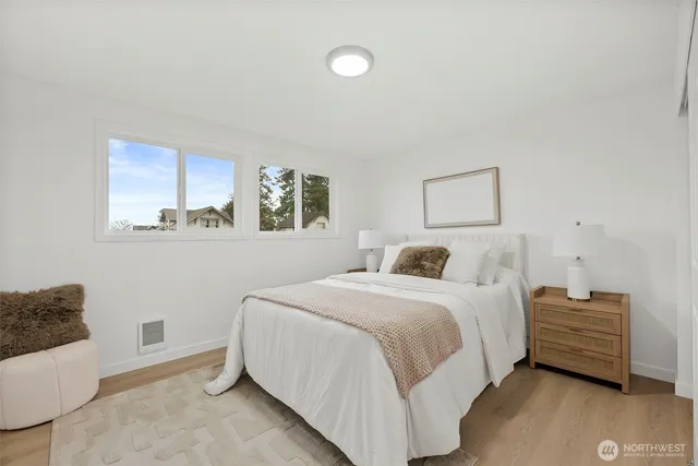 a view of room with window and wooden floor