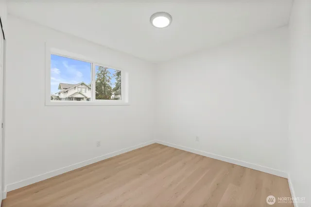 a bedroom with a bed and a desk