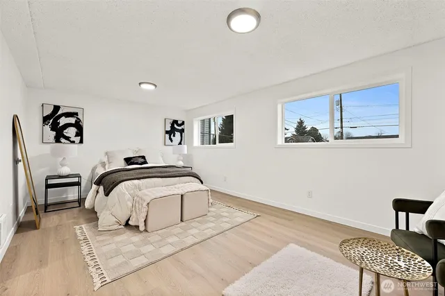 a bedroom with bed and a couch