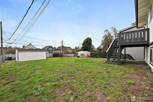 a house with green field in front of it