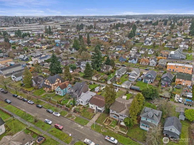 an aerial view of residential houses with outdoor space