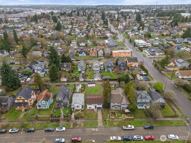 an aerial view of houses with yard