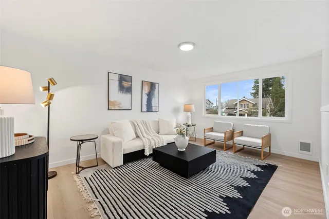 a living room with furniture and a rug