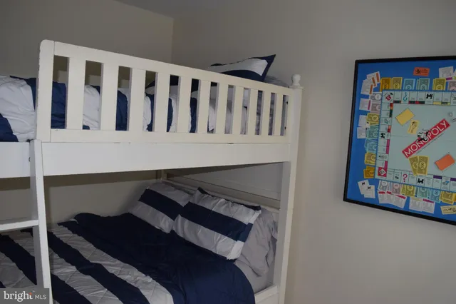a bathroom with a toilet and a mirror