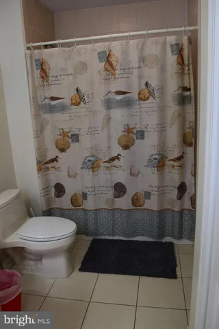 a view of a room with furniture and window