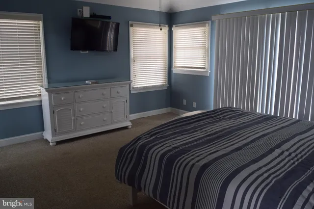 a kitchen with a wooden floor and a window