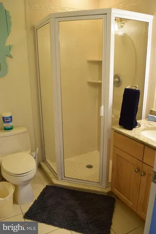 a view of a bathroom with a sink and mirror