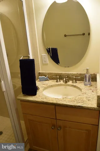 a white toilet sitting next to a bathroom sink