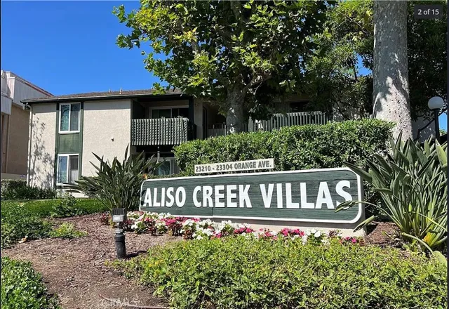 a view of a chair and table in the backyard