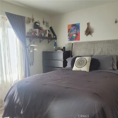 a bed room with a bed and a walk in closet