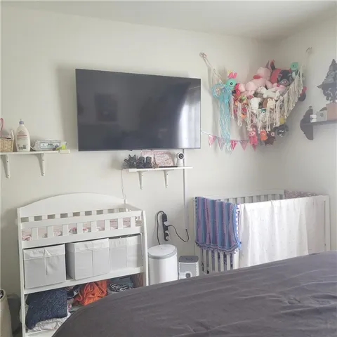 a kitchen with a wooden floor and breakfast area