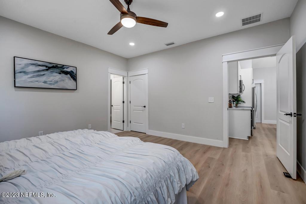 1281 Glen Laura Road Jacksonville, FL 32205 - Photo 17 of 33 a bedroom with a bed and a painting on the wall