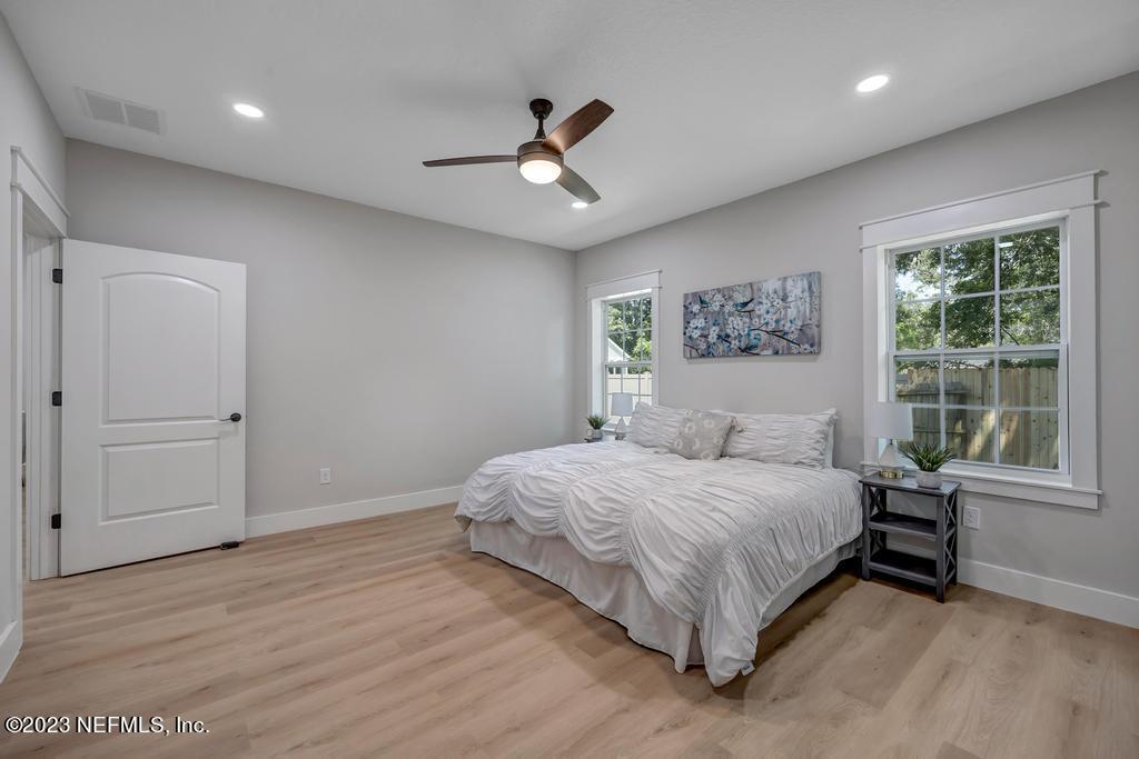 1281 Glen Laura Road Jacksonville, FL 32205 - Photo 18 of 33 a bedroom with a large bed and a window