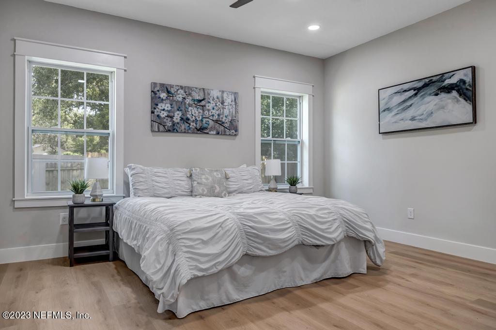 1281 Glen Laura Road Jacksonville, FL 32205 - Photo 19 of 33 a bedroom with a large bed and a window
